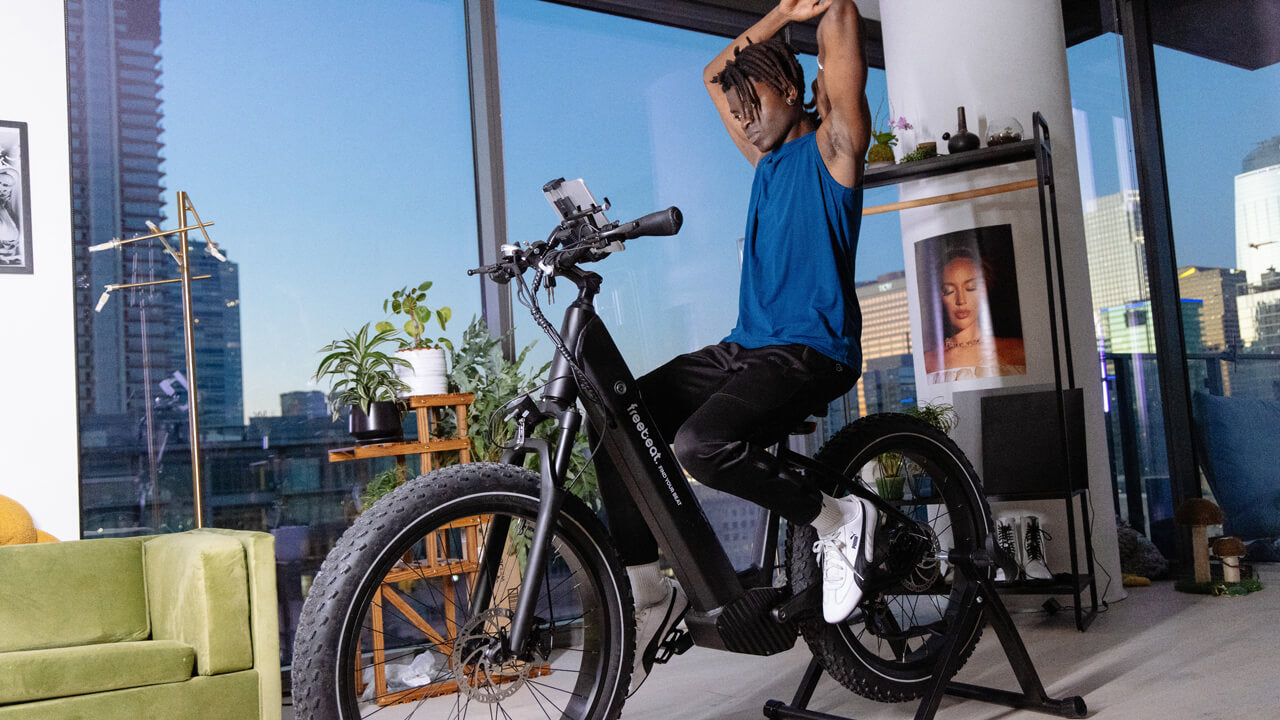 A man is charging an electric bicycle