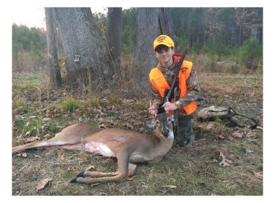 CJ with his first buck