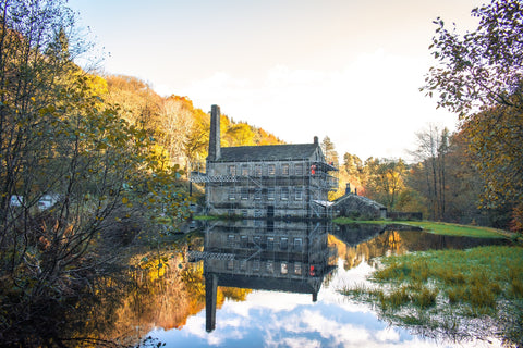 Reflection of Gibson Mill on the mill pond at Hardcastle Crags in Yorkshire