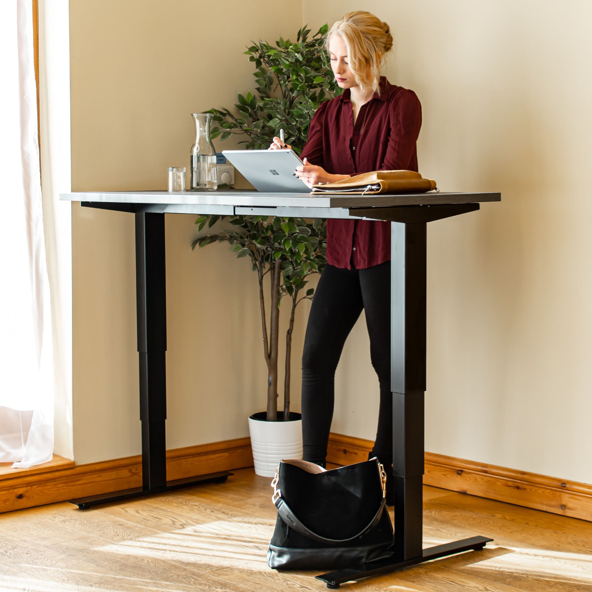 Adjustable Computer Desk - Masta - Woman Working Using the Desk