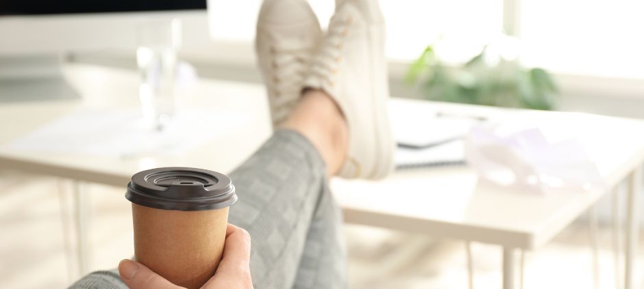 Sitting at desk with feet up - sedentary lifestyle whilst working