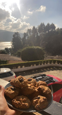 Plate of oat chocolate chip rock cakes a balcony in the sun