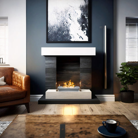 Small ethanol burner in a fireplace in a lounge with furniture