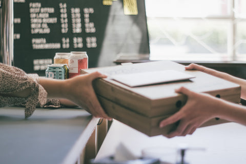 A box exchanging hands at a SMB store