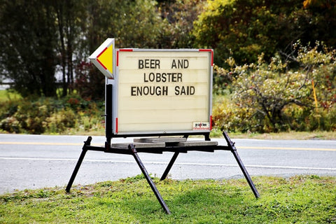 A sign that says Beer and Lobster, Enough Said