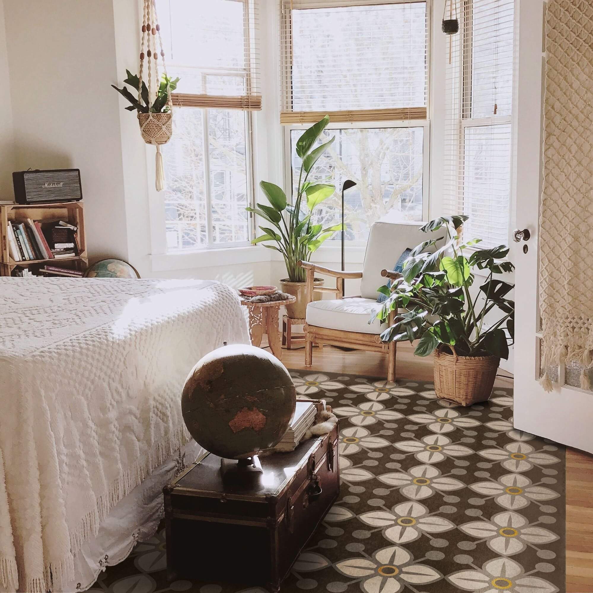 bedroom with printed vintage vinyl rug at foot of bed