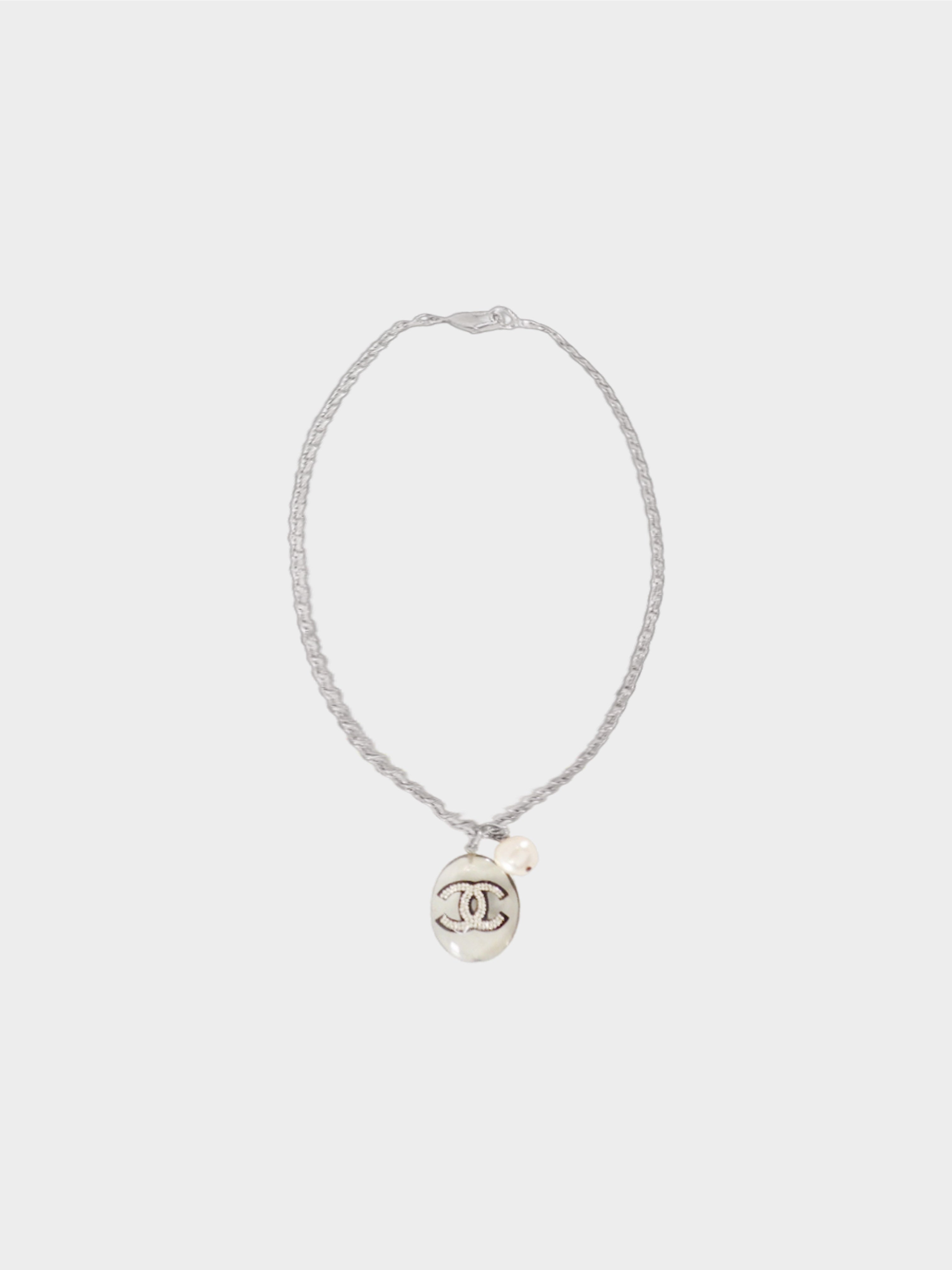 silver chanel charm