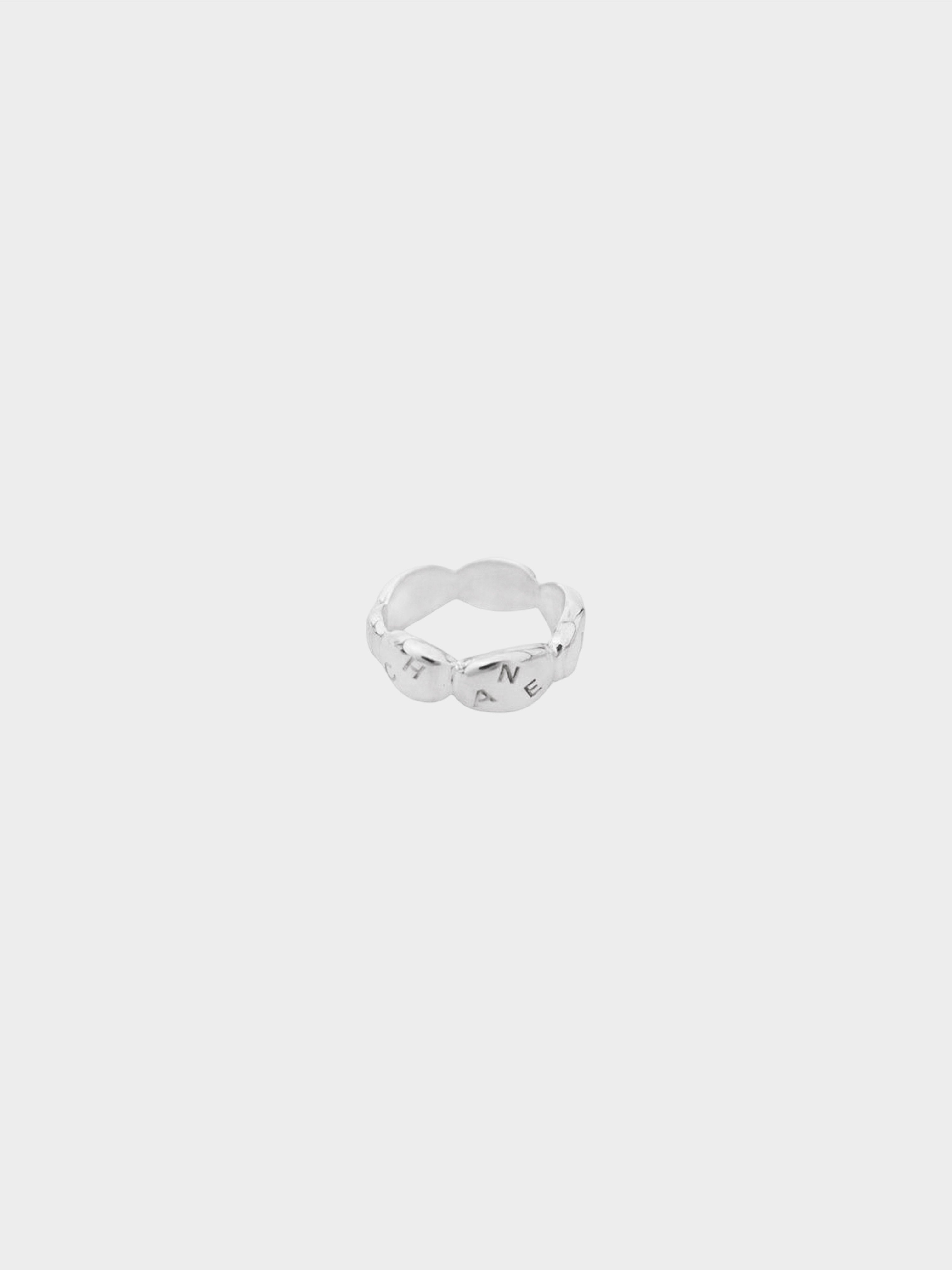 Chanel 1990s Silver Camellia Radis Logo Ring