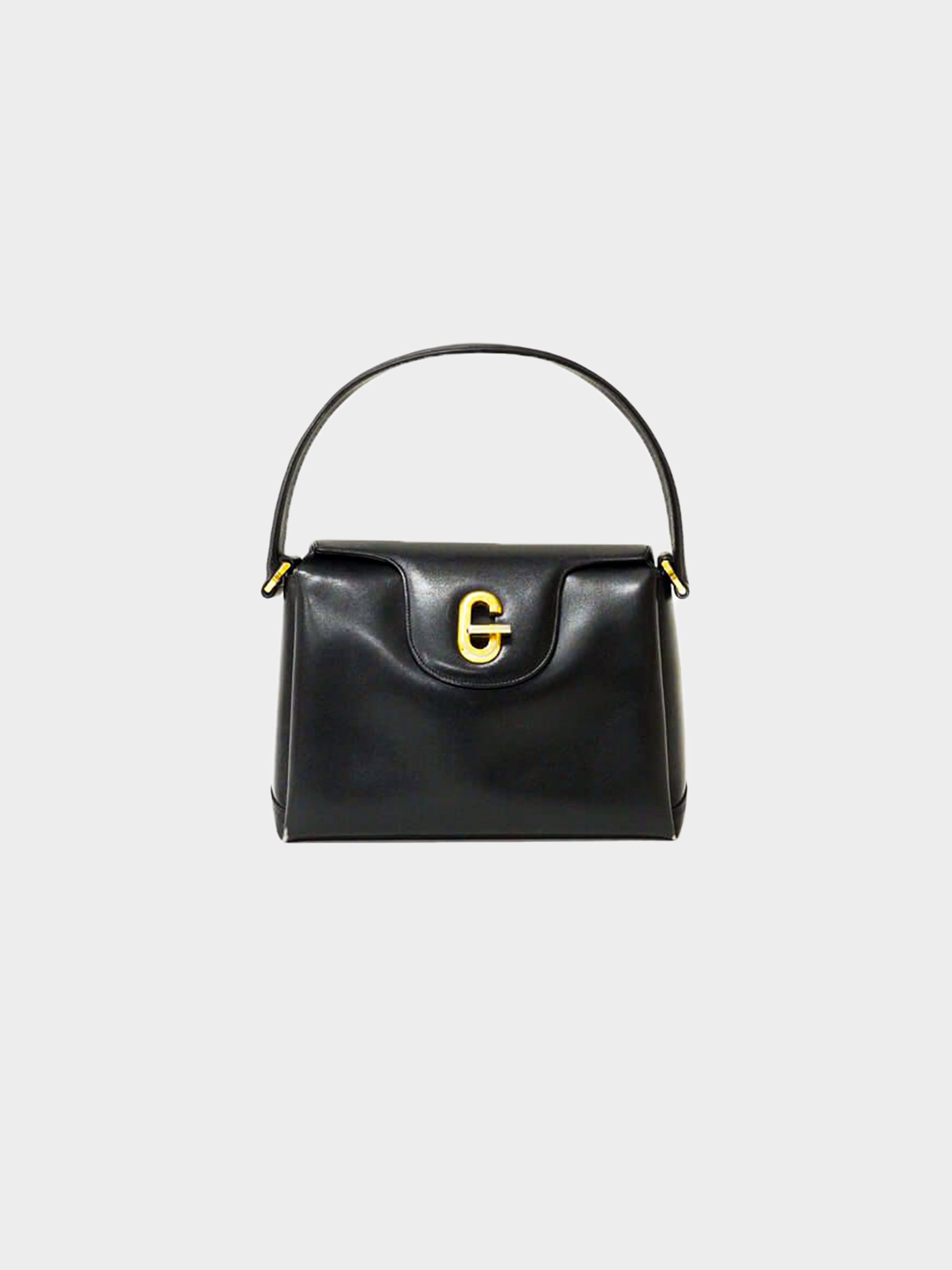 Gucci 1970s G Metal Leather Hand Bag · INTO