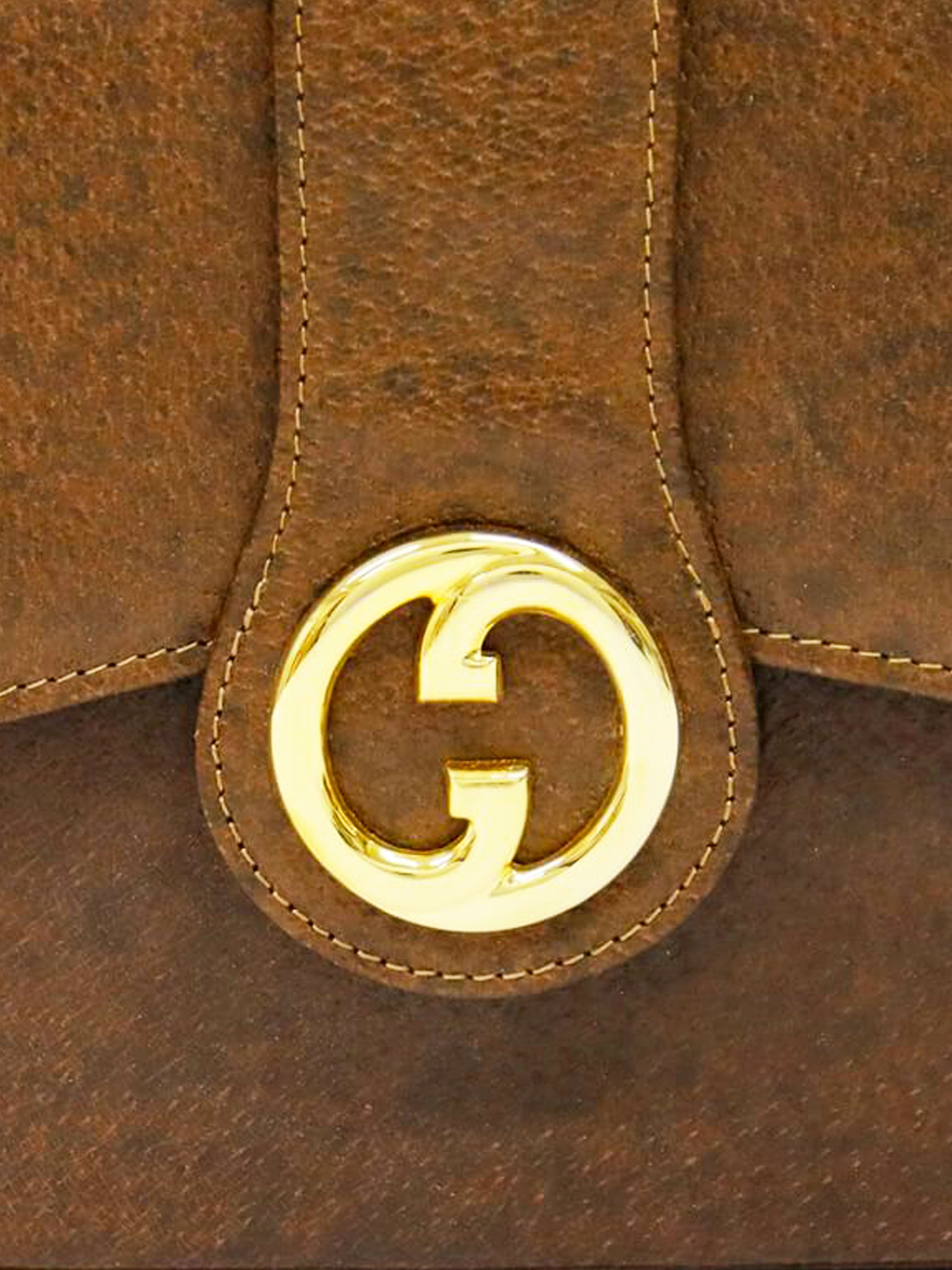 Gucci 1990s GG Metal Brown Leather Hand Bag · INTO