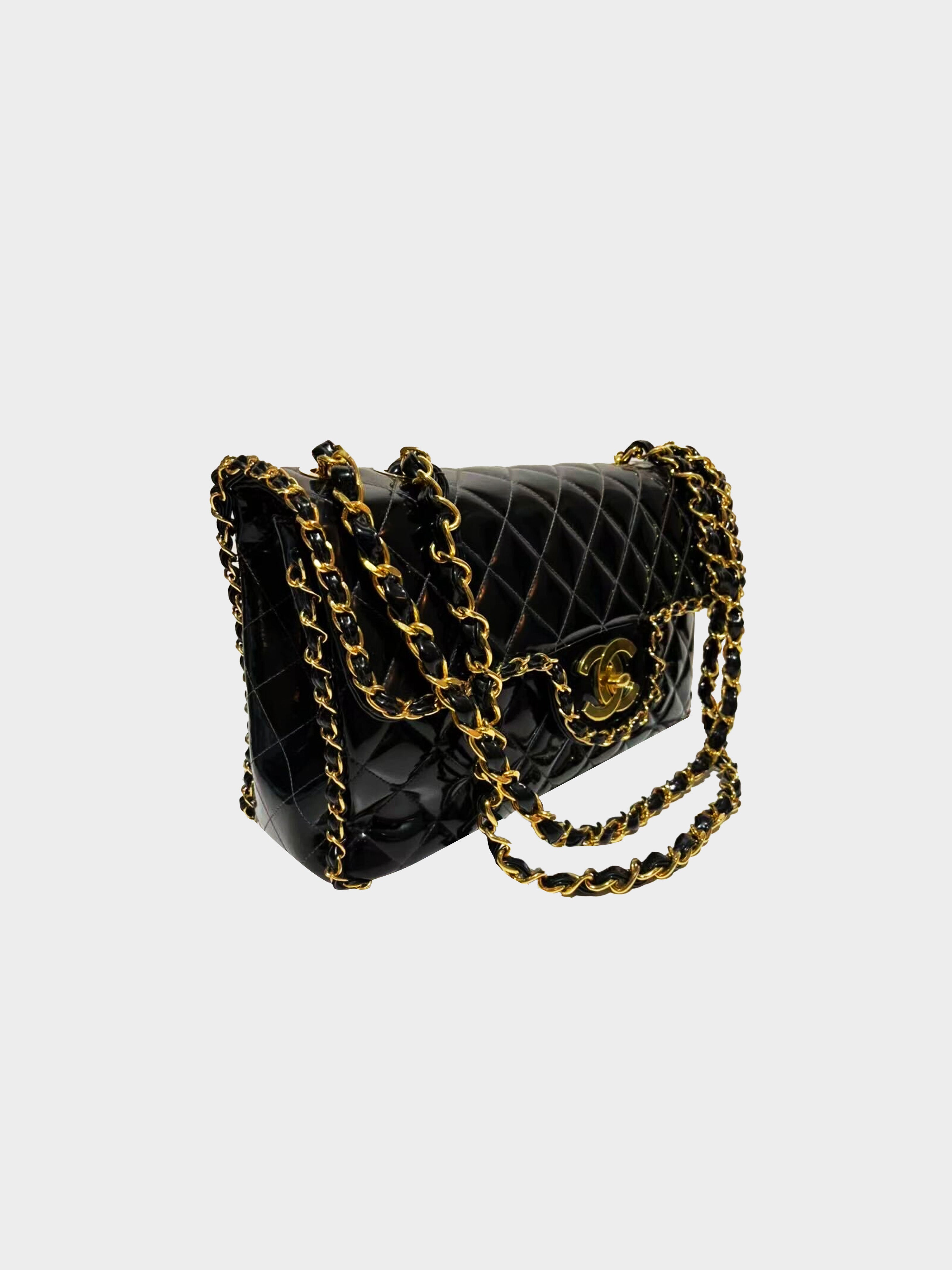 A BLACK PATENT LEATHER CHAIN AROUND MAXI FLAP BAG WITH GOLD HARDWARE