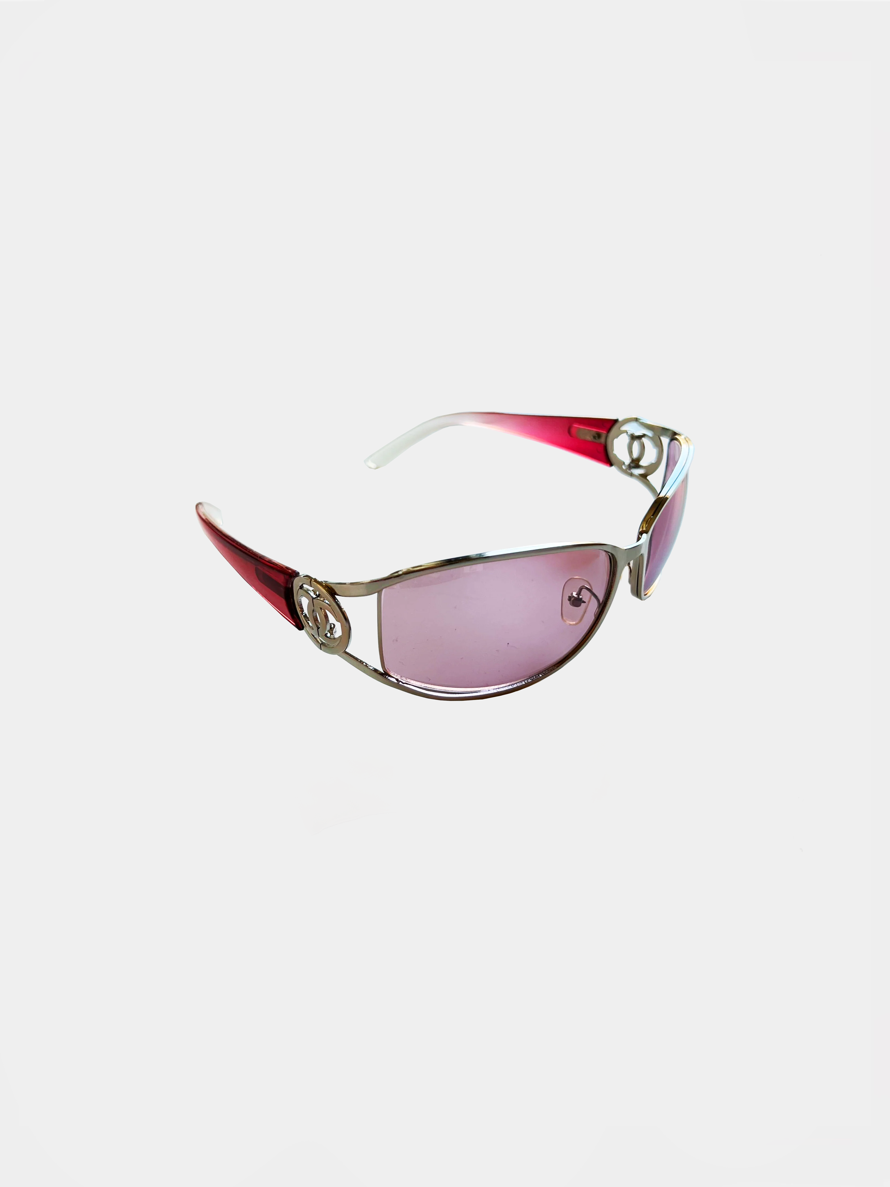 Chanel sunglasses with pink and gold square frames and pink lenses