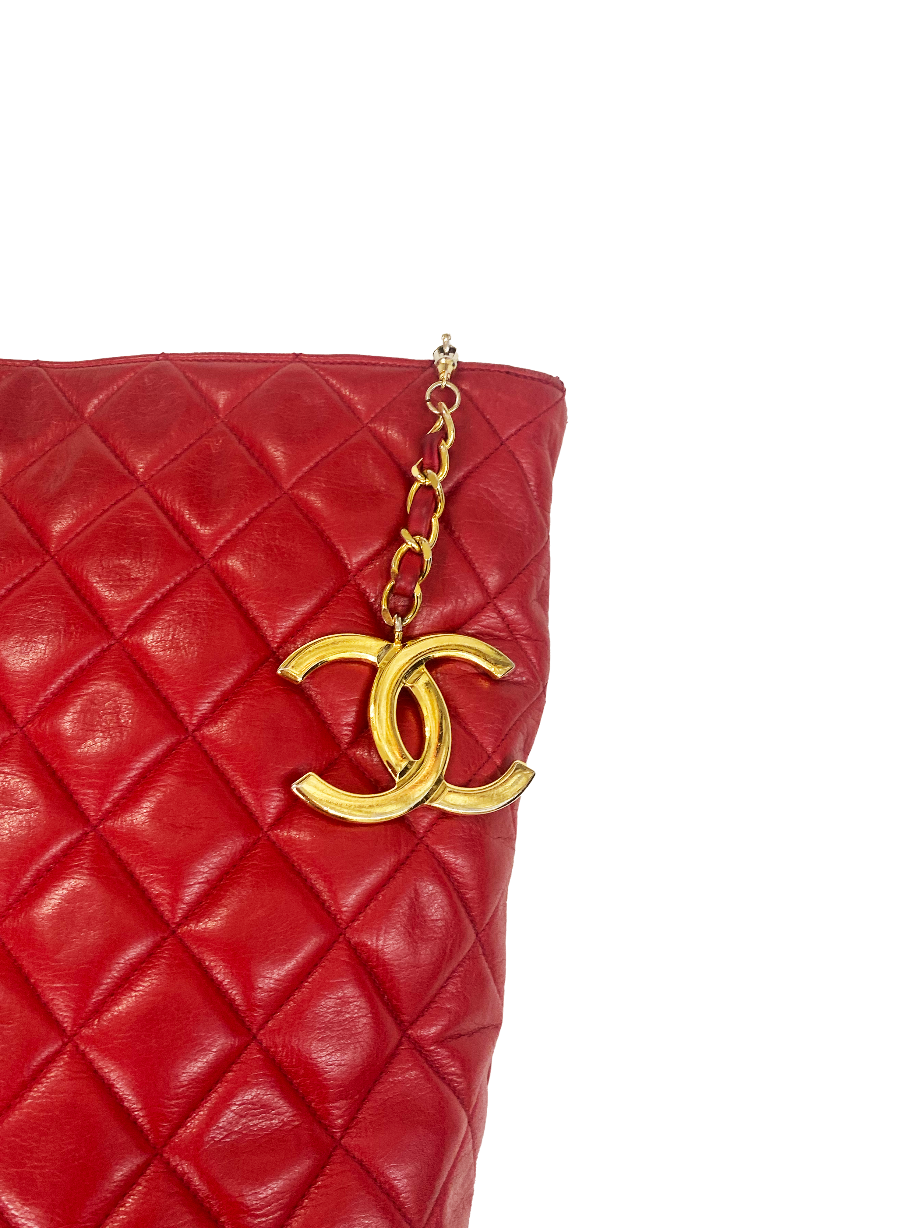 Vintage CHANEL red lamb leather shoulder bag with golden CC button