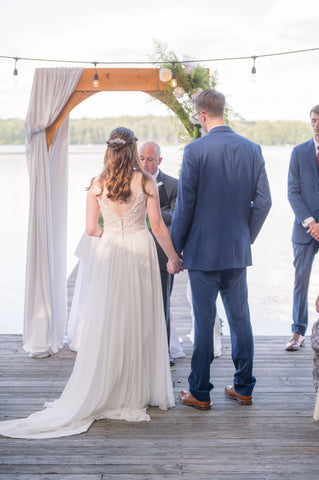 Anna and Paul getting married by the water