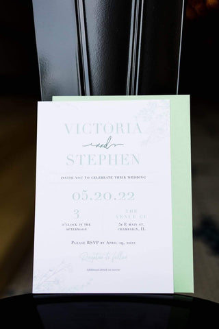 Wedding invitation with floral outlines and mint green envelope