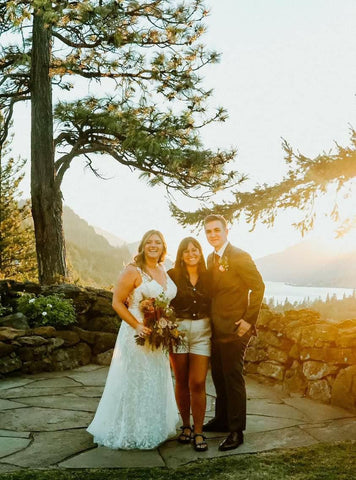 Daniela with couple on their wedding day