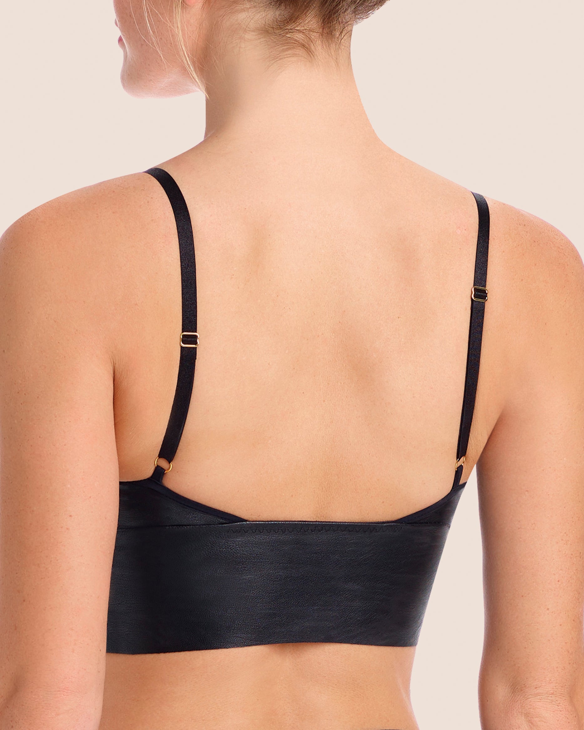 https://cdn.shopify.com/s/files/1/0593/1017/8440/products/commando-faux-leather-longline-bralette-black-4.jpg?v=1662548329