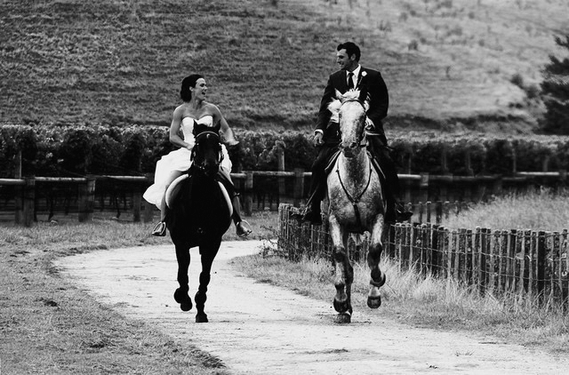 Mickey and Clem pictured riding to their own wedding reception on horseback.