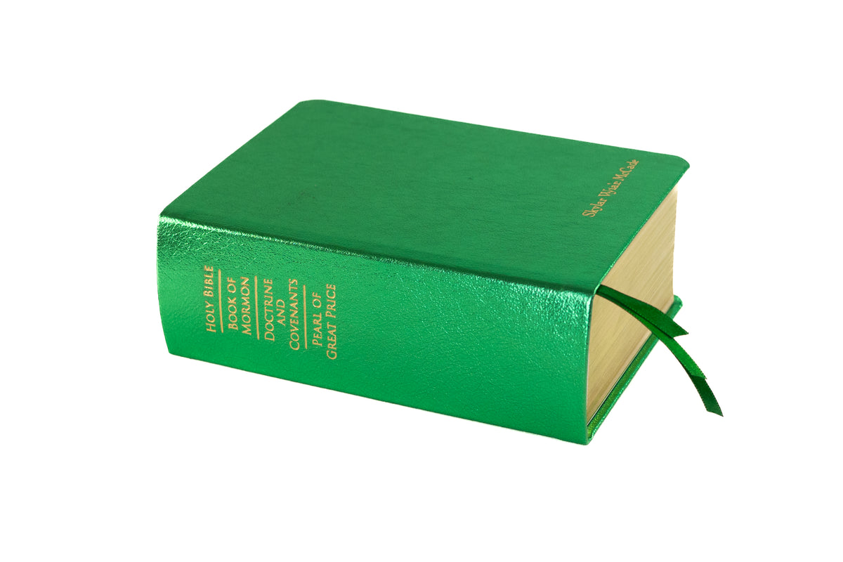 Leather Metallic Green Quad Engraved with Gold Lettering, in Front of a White Background | Custom LDS Scriptures & Rebinding Services | Color Scriptures