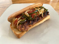 Smoked Sausage and peppers sandwich made with Dickey's Jalapeno Cheddar Kielbasa