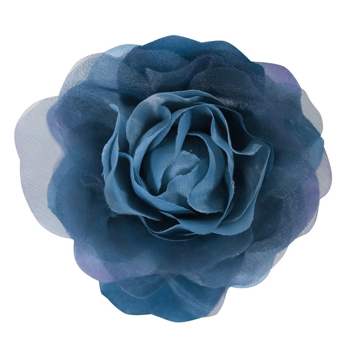 A single wheeled navy corsage that resembles a rose flower