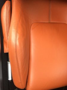 Aston martin seat in daylight focused on arm