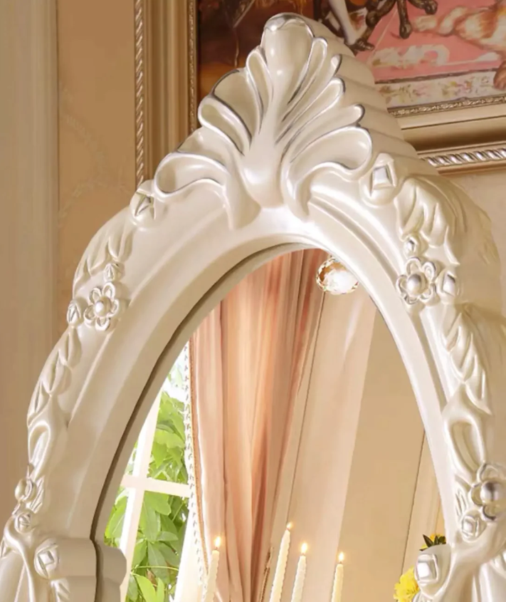 Our French Vintage White Cream Frame Full Length Mirror is the epitome of classic elegance combined with modern functionality. It offers a charmingly rustic yet sophisticated aesthetic that can seamlessly blend into any room, whether it's your bedroom, living room or hallway. Crafted meticulously with a vintage white cream wooden frame, this mirror adds a touch of grandeur and richness to your home. Its full length feature provides you with a complete look from head to toe, making it ideal for dressing up before stepping out. Not just a functional piece, but a trendy home décor accessory as well. This Full Length Mirror complements various interiors, echoing an old-world charm with a modern twist. Elevate your home décor with this beautiful and practical piece of art.