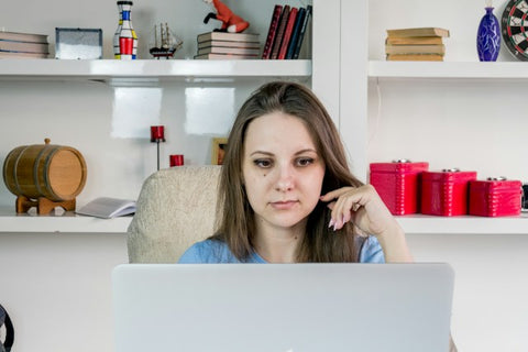 Woman Sitting In Front Of A Laptop