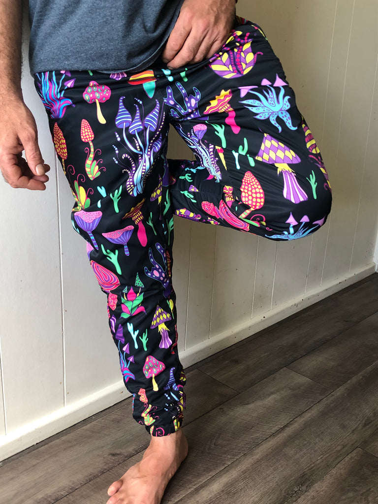 Men's track pants with a trippy mushrooms pattern