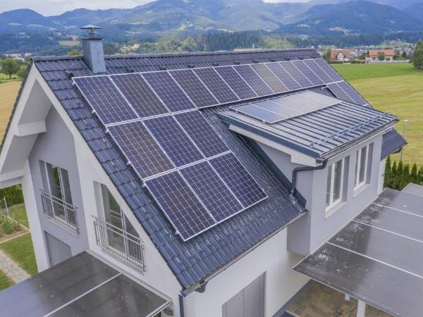 Aerial view of a private house with solar panels on the roof-1.png