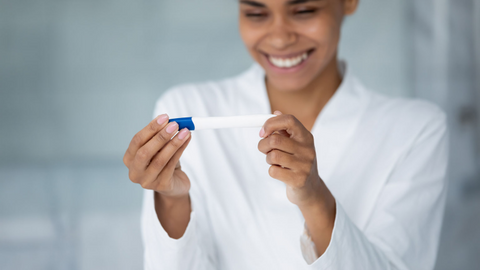 woman with pregnancy test