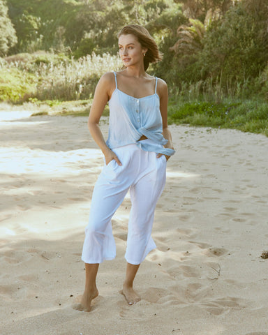 woman wearing the weslie blue tie cami top at the beach