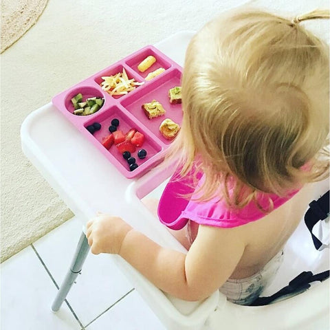 Toddler enjoying a meal from bobo&boo dinnerware