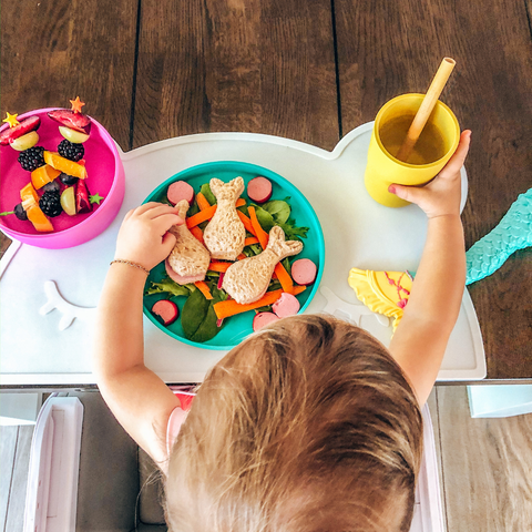 Child using bobo & boo plate, bowl and cup