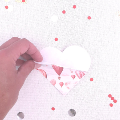 Sew or glue bottom part of paper hearts to create a pocket