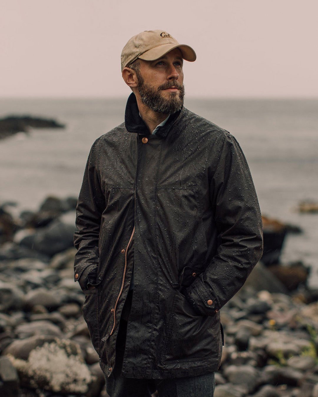 Gentleman wearing a Private White Jacket near the coast