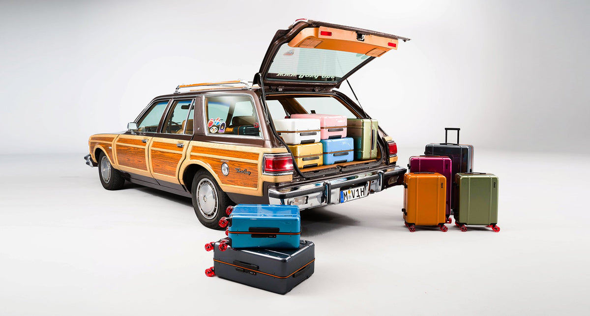 Classic car with a selection of Floyd suitcases