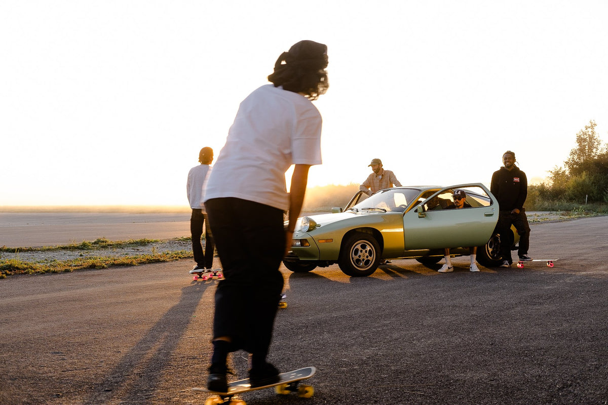 A group of skateboards with a Porsche