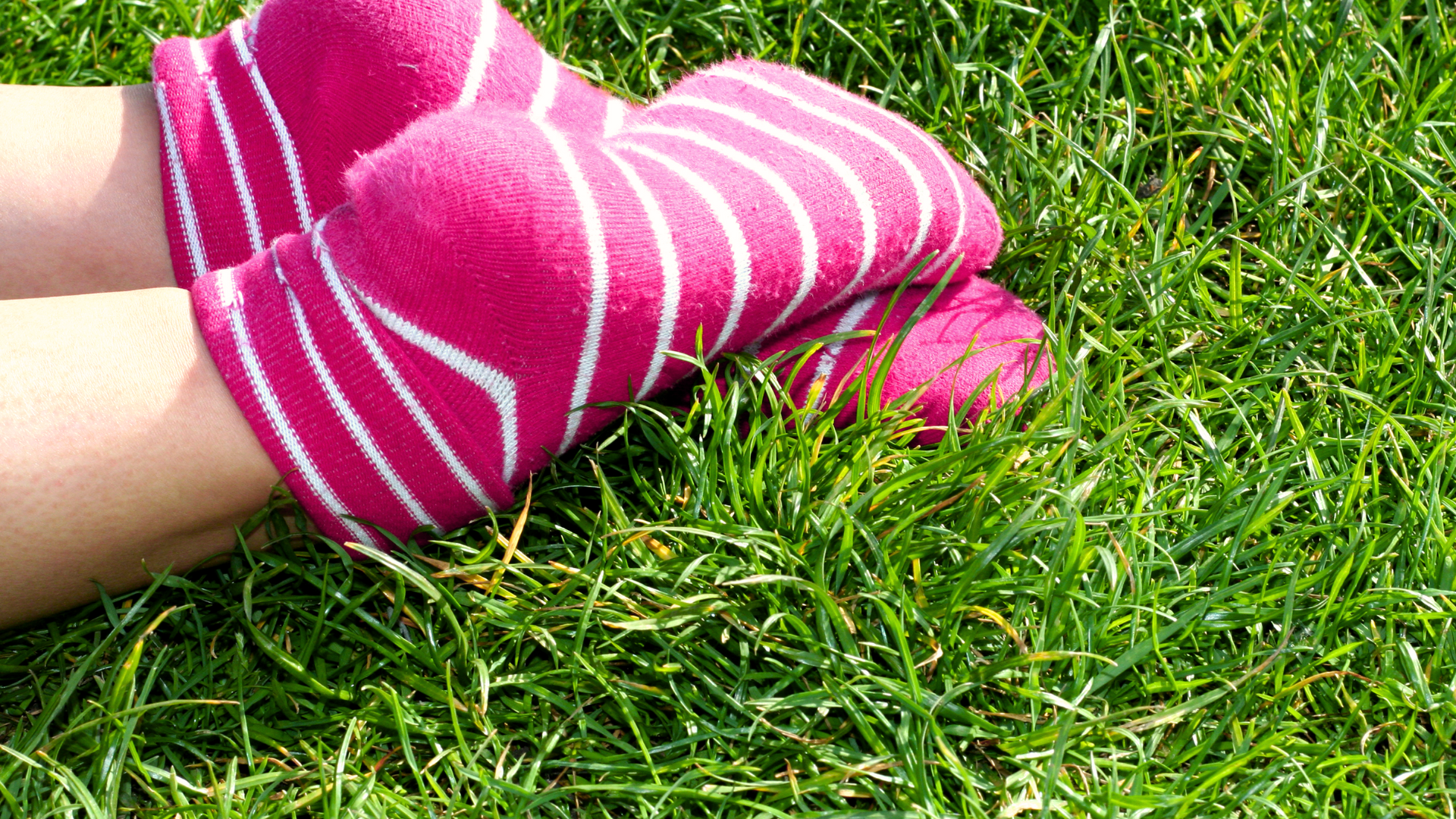 person wearing pink-striped socks