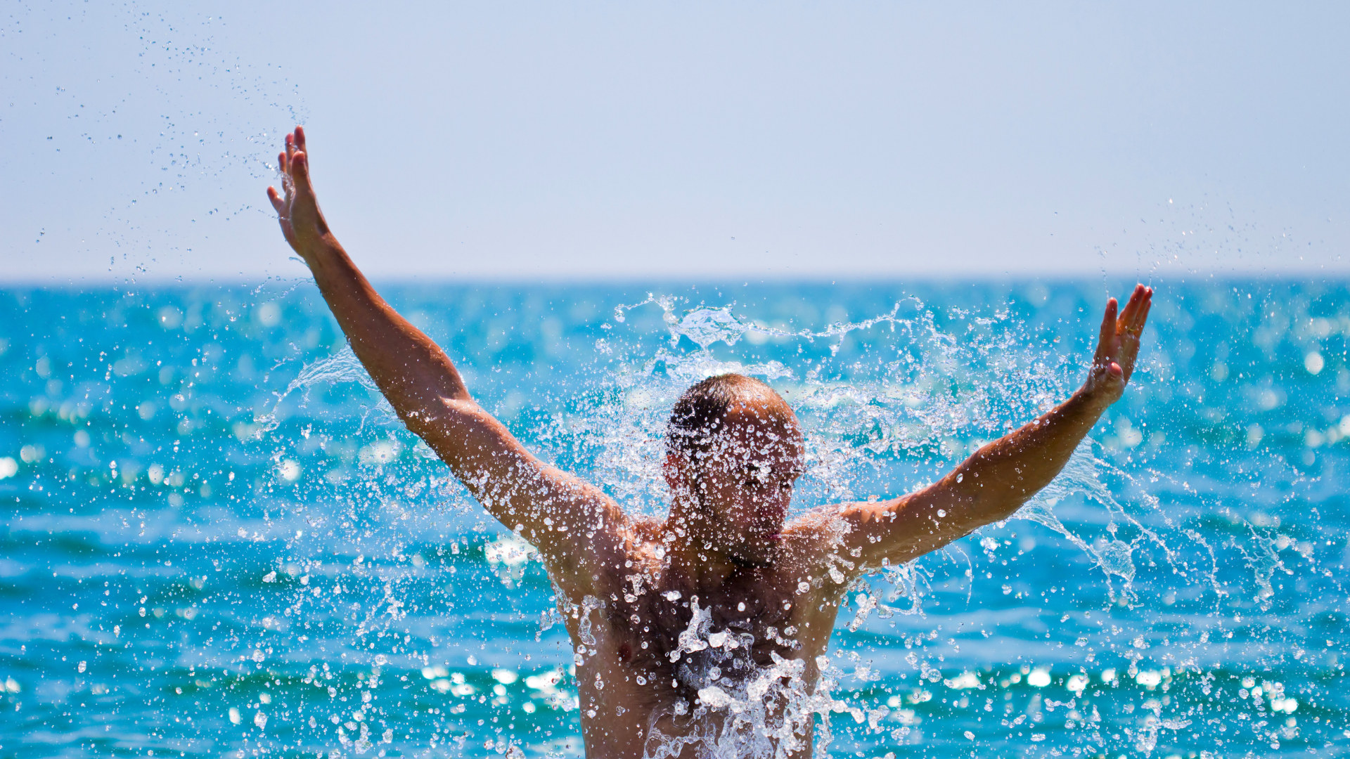 man swimming in the sea