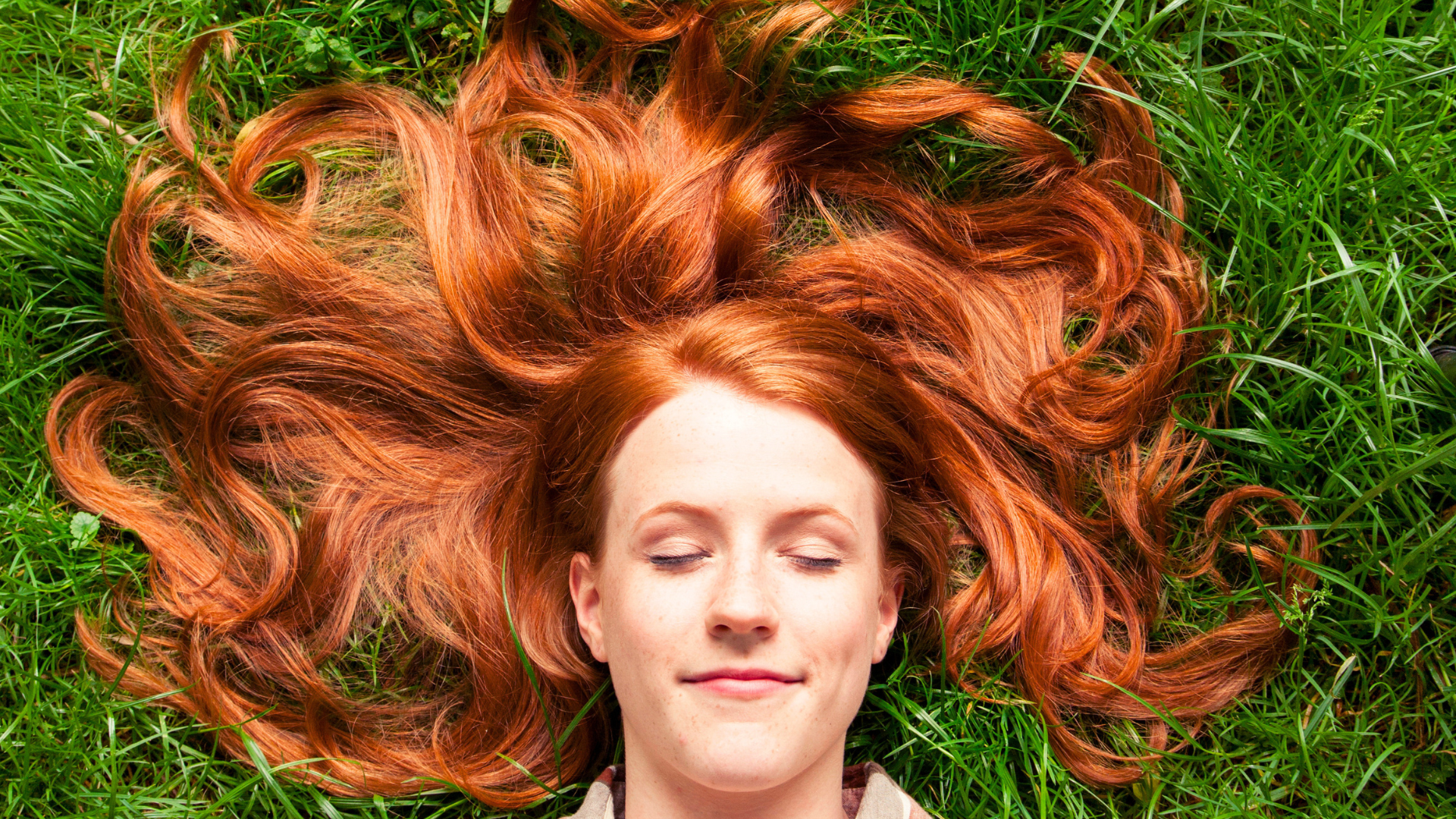 woman lying down in the grass