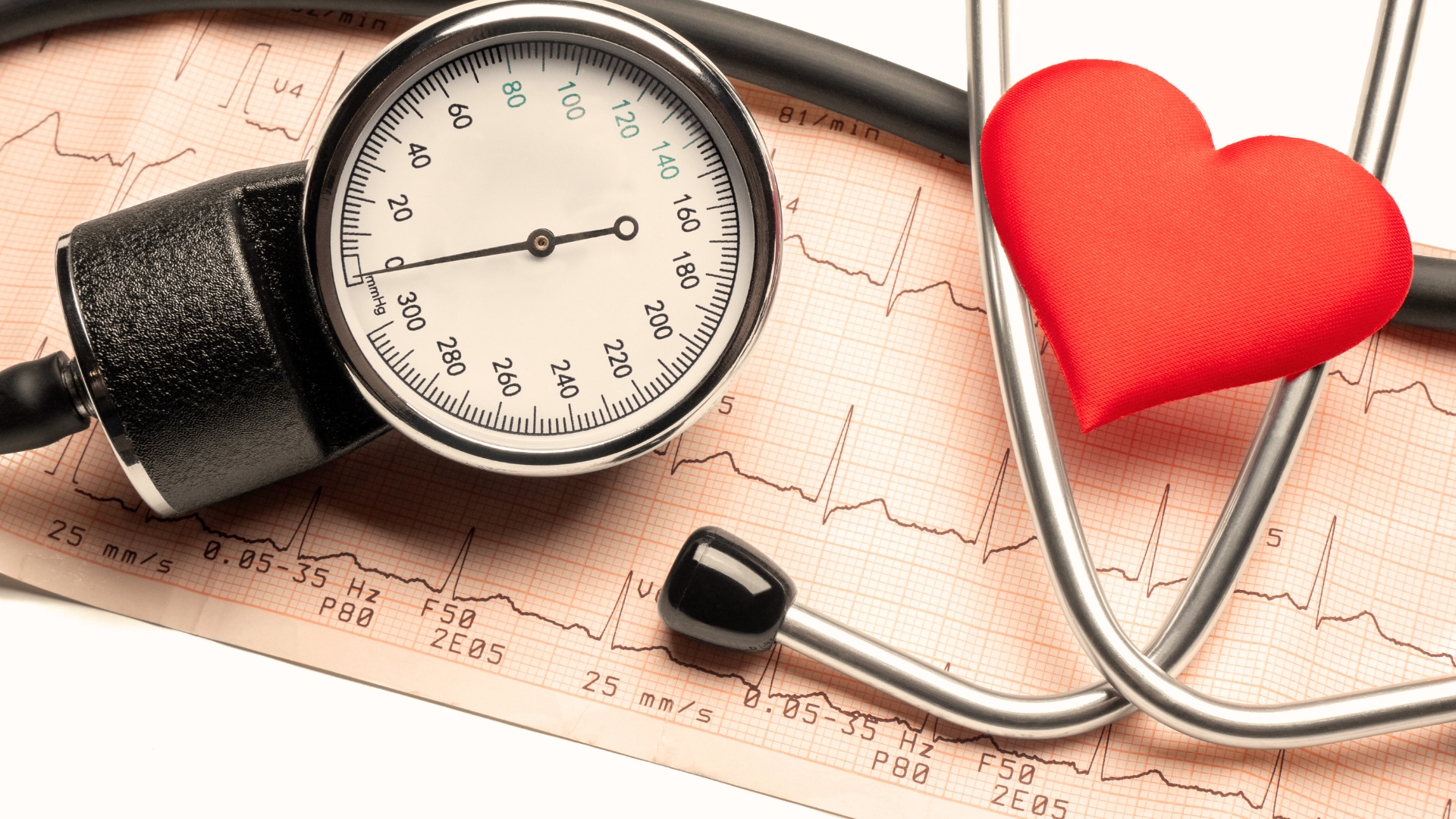 stethoscope beside a heart