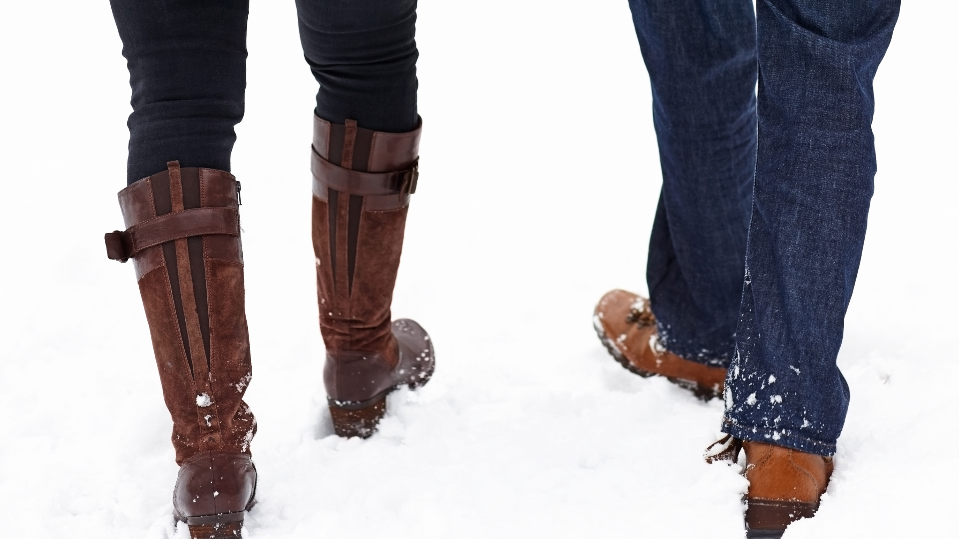 couple walking in snowy weather