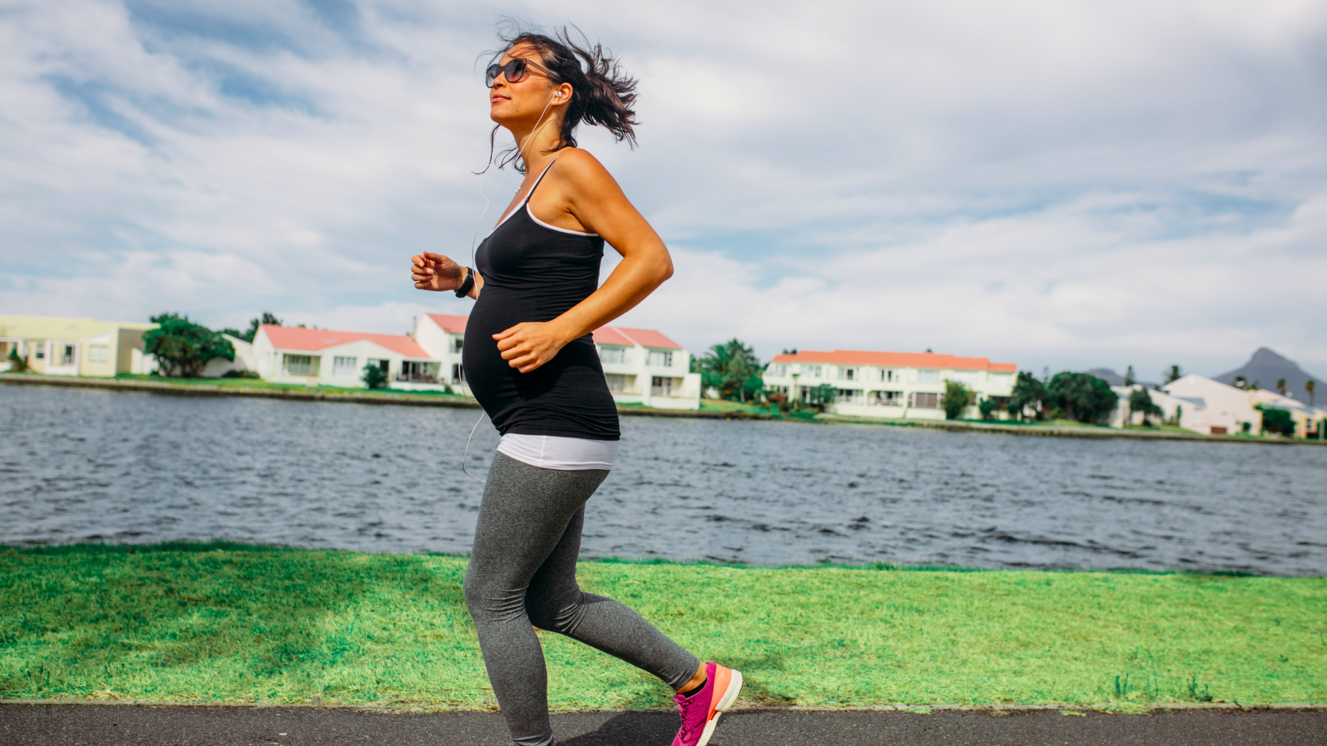 pregnant woman jogging near the lake