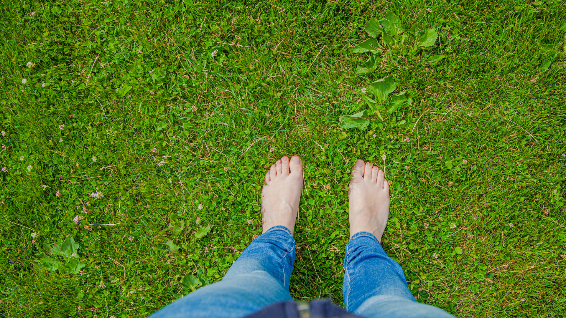 person on barefoot on the grassfield