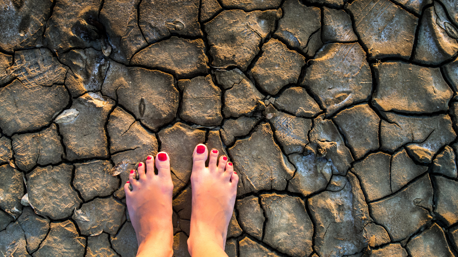 woman in barefoot on the rock