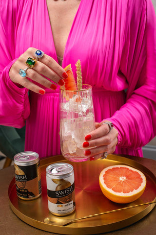 A party guest enjoying an alcohol free pre mixed mocktail