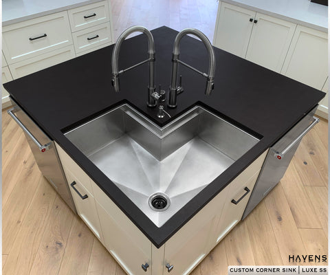 Custom stainless steel corner sink by Havens Luxury Metals with a black countertop and 16 gauge type 316 stainless.