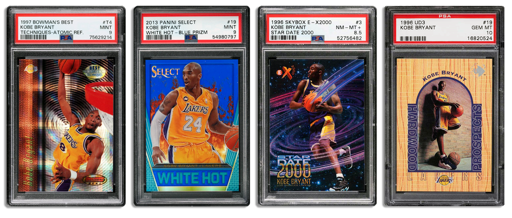 Image displaying four basketball trading cards, each encased in PSA slabs. The cards are: a 1997 Bowman's Best Kobe Bryant Atomic Refractor, a 2014 Panini Select Kobe Bryant Blue Prizm, a 1996 Skybox E-X2000 Star Date 2000 Kobe Bryant, and a 1996 UD3 Kobe Bryant