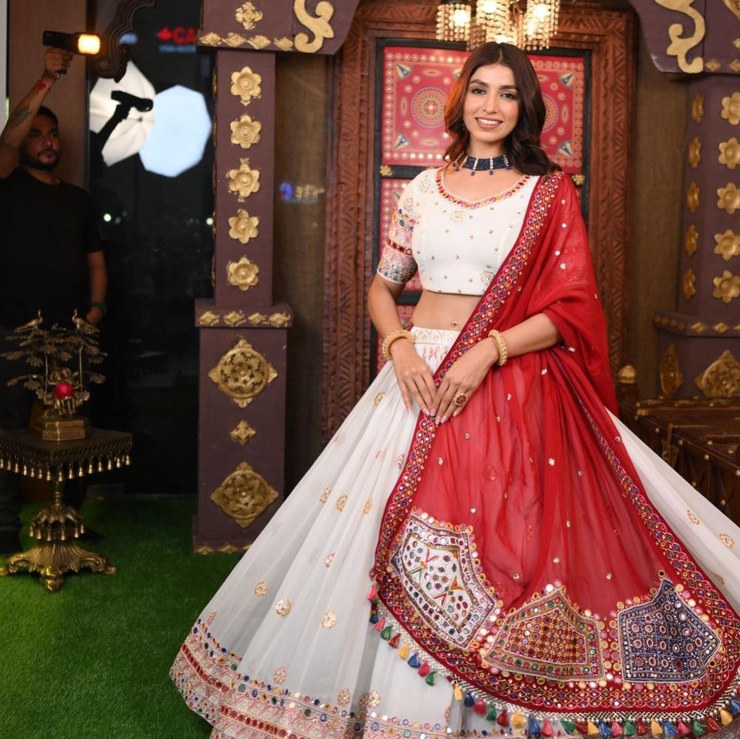 swornimstudio on Instagram: “White frill lehenga with red blouse and tassel  shawl. A simple… | Wedding lehenga designs, Dress indian style, Designer  dresses indian